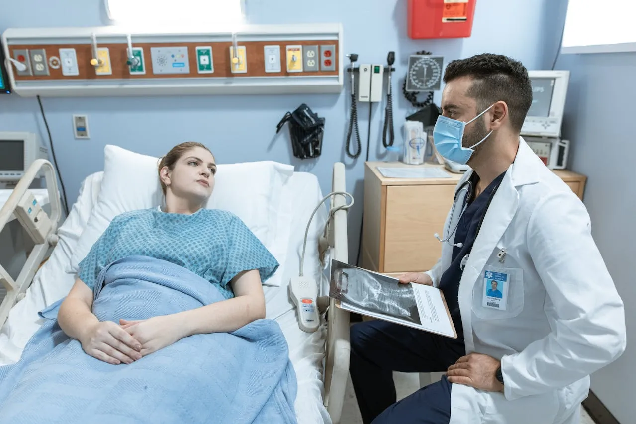 Clinician speaking with a patient about managing a chronic condition